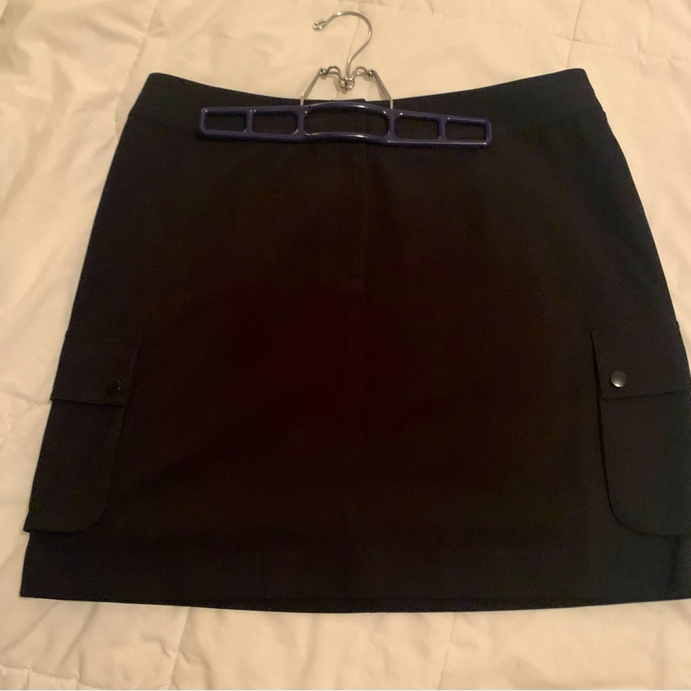 Black golf skirt INC size 14 double clip clasps at waist 2 side pockets A-line